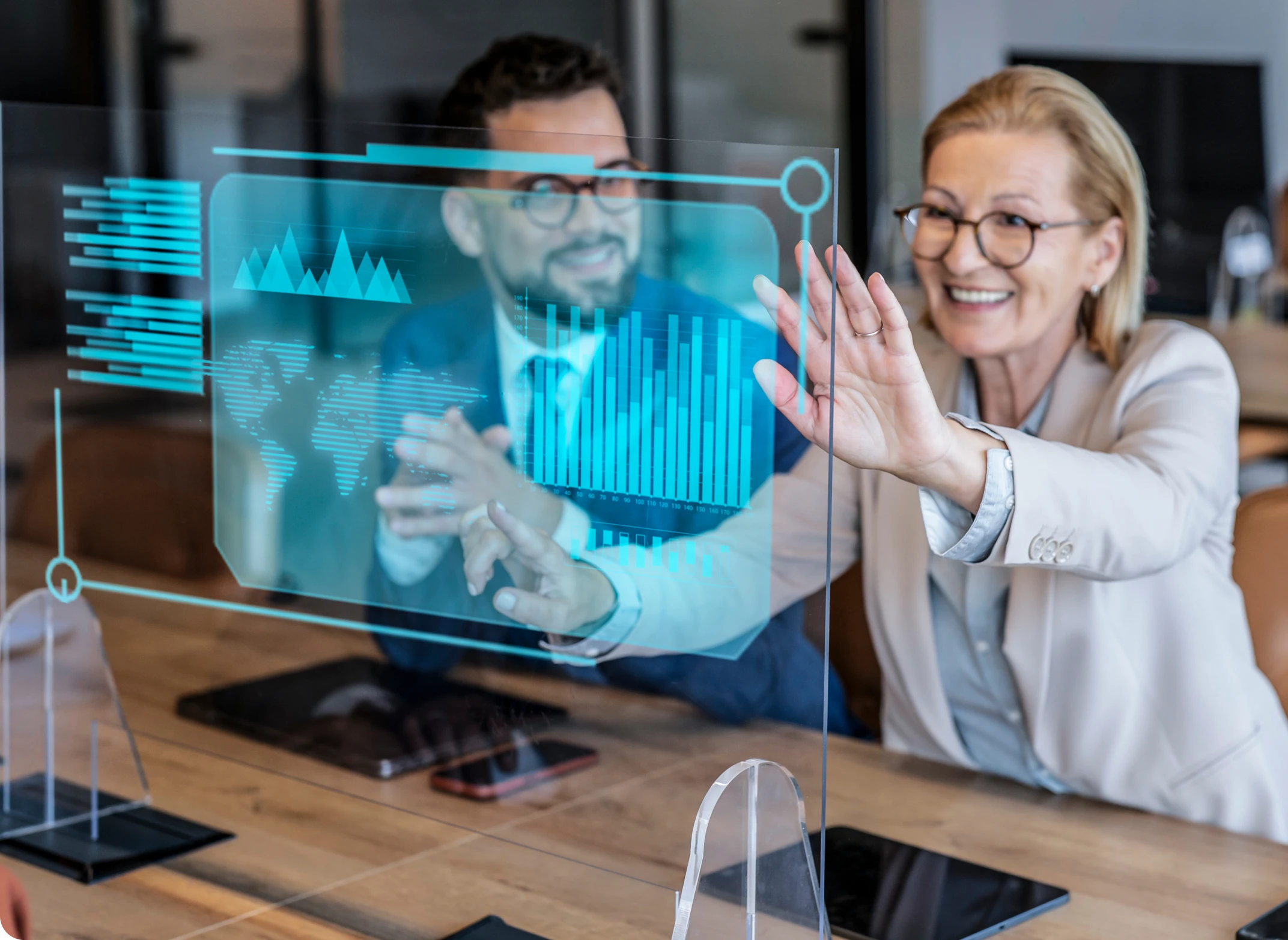 Colleagues interacting with transparent virtual screen
