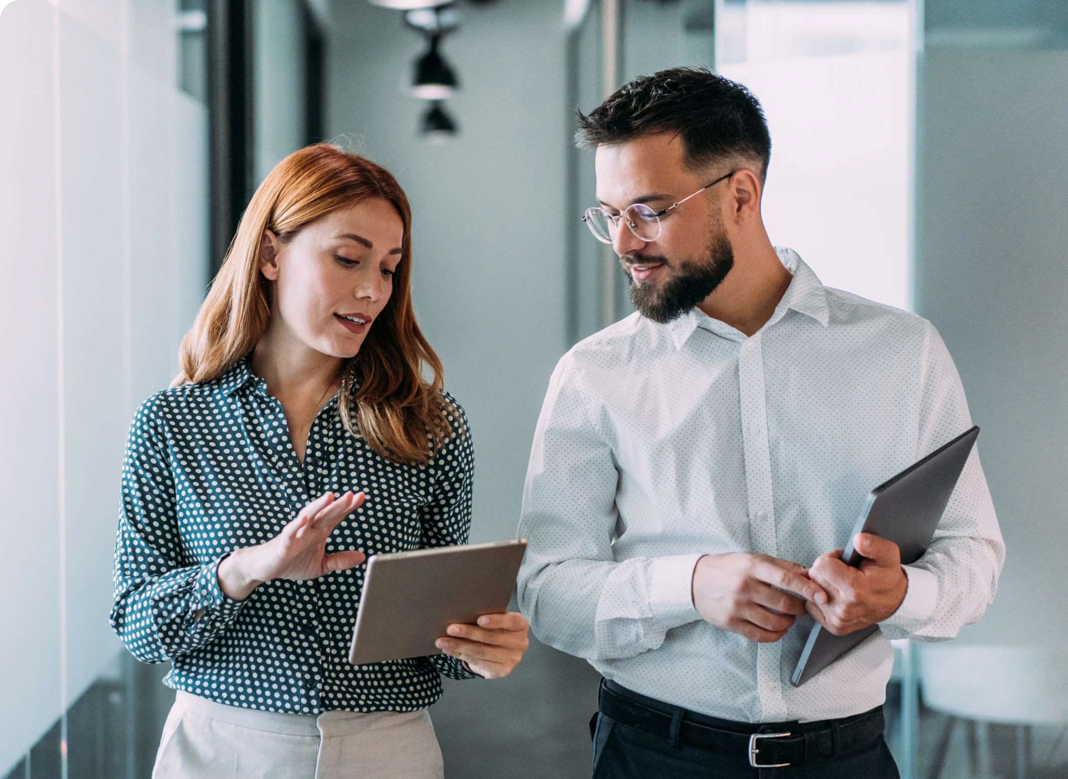 Professionals reviewing information on tablets